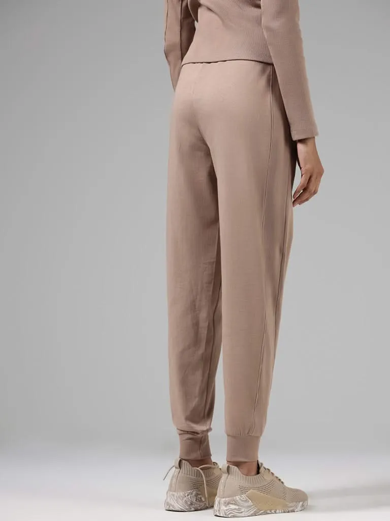 Studiofit Solid Beige Cotton Relaxed-Fit Mid-Rise Joggers